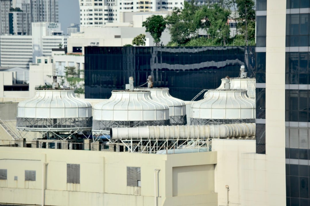 Industrial cooling towers on a commercial building rooftop